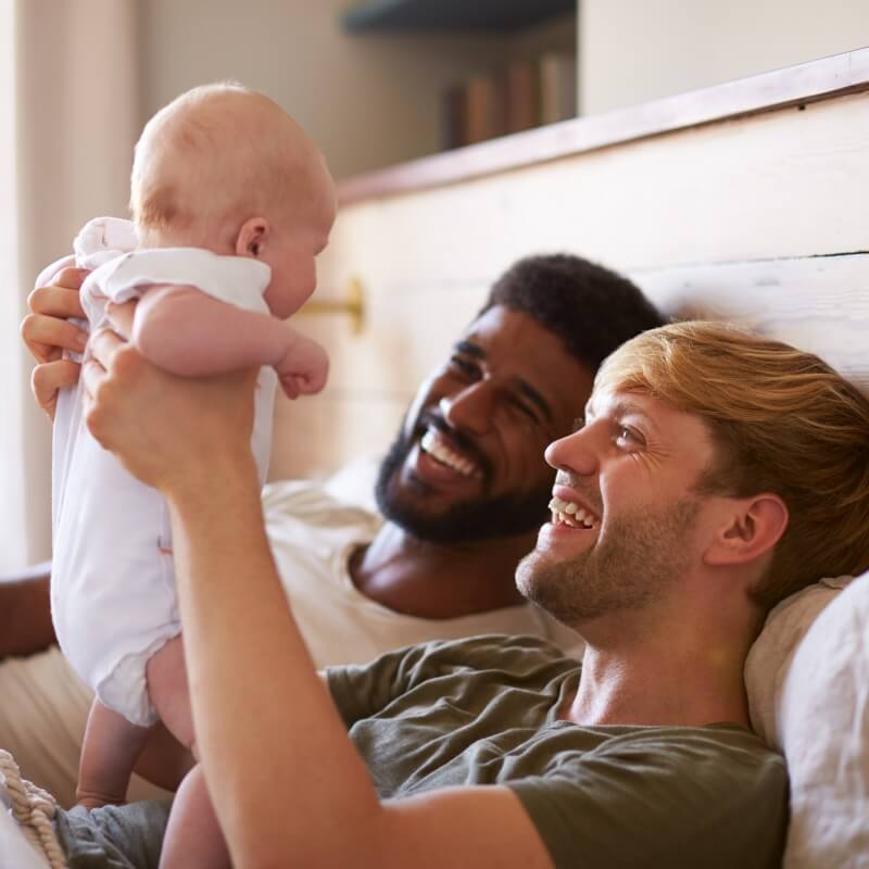 Man smiling with child