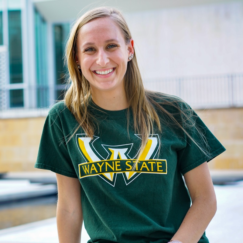 Student smiling with Wayne State shirt on